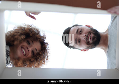 View from the bottom of the newlyweds looking inside the box. Stock Photo