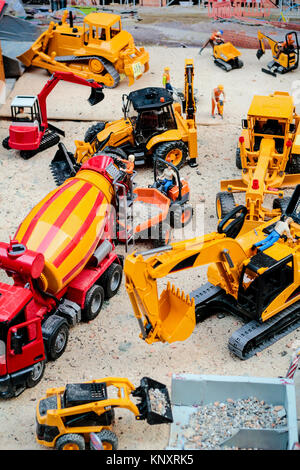 The building yard in toy version, there are the crane and crawlers work Stock Photo