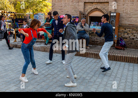 Uzbek People Dancing In The Street, Khiva, Uzbekistan Stock Photo