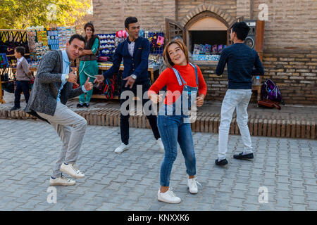 Uzbek People Dancing In The Street, Khiva, Uzbekistan Stock Photo