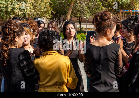 Female Wedding Guests Dance In The Street During Wedding Celebrations,  Khiva, Uzbekistan Stock Photo