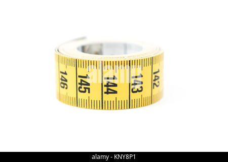Yellow measuring tape. Sewing and tailoring accessories Stock Photo