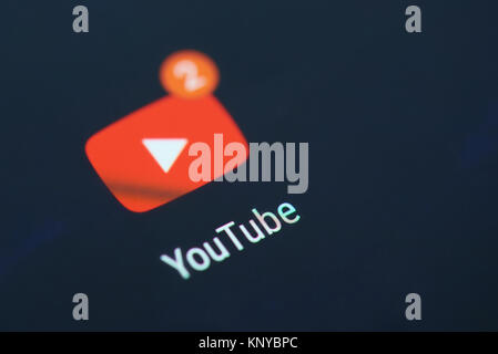 New york, USA - December 12, 2017: Youtube application icon on smartphone screen close-up with new videos on subscriptions Stock Photo