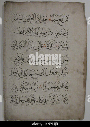Islamic manuscript folio featuring Arabic calligraphy on paper with ...