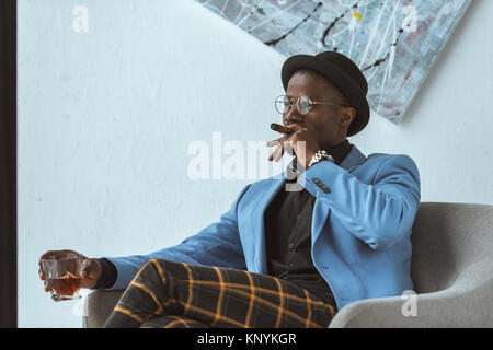 stylish man smoking cigar Stock Photo