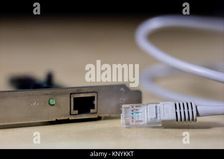 old computer wires. Cables lpt, com1 and com2 for desktop and laptop computers. Wooden table, black background. Stock Photo