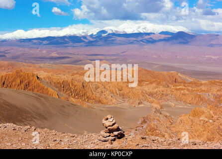 Picturesque multilayer landscape of Atacama Desert, Chile.  The change in landscape from red rocks on foreground to the mountains snow peaks on the ho Stock Photo