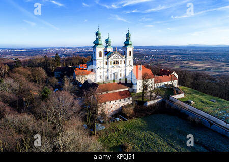 Camaldolese monastery and baroque church in the wood on the hill in Bielany, Krakow, Poland , Aerial view in winter Stock Photo