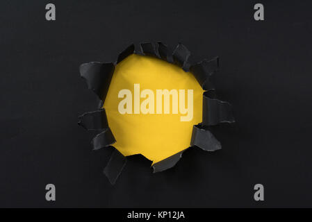 black torn paper and yellow paper with copy space. for background and wallpaper Stock Photo