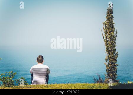 A man contemplating the ocean