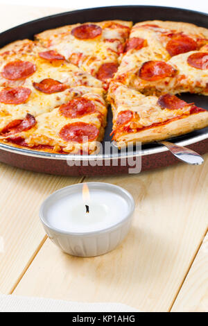 pizza on pan with spatula