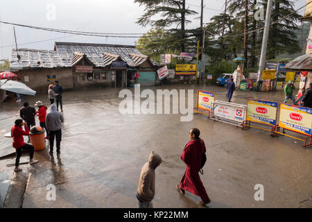 Buddhist monks walk through the main chowk in Mcleod Ganj, India Stock Photo