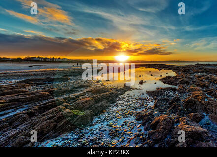 New Year's Eve sunset on Ballyholme beach, Bangor, County Down, Northern Ireland. Stock Photo