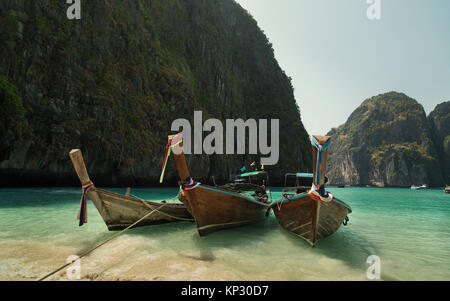 Longtail boats anchored at Maya Bay on Phi Phi Leh Island, Krabi Province, Thailand. It is part of Mu Ko Phi Phi National Park. Stock Photo