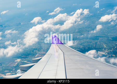 photo from the window of an airplane flying over Thailand, view of the wing Stock Photo