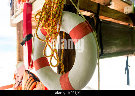 life ring and rope close-up on the beach Stock Photo