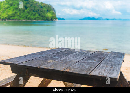 old wooden worktops against the sea to insert objects Stock Photo