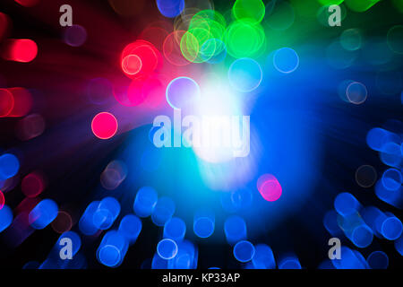 Fiber optical network cable and blurred light for background and wallpaper. Stock Photo