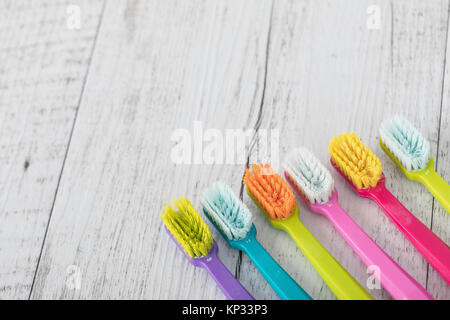 New and used color ultra fine toothbrushes on the table. Dental Industry. various types of toothbrushes. Beautiful smile concept. Whitening. Tooth car Stock Photo