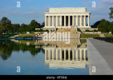 Landscape daytime shot of the Lincoln Memorial and reflection in the reflecting pool, Washington DC, USA on a sunny day with light cloud Stock Photo