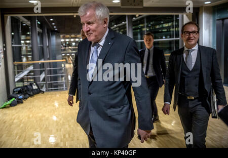 Berlin, Germany. 13th Dec, 2017. Horst Seehover (C), chairman of the Christian Social Union in Bavaria (CSU) and Bavaria's Premier, and Alexander Dobrindt, the state party group leader of the CSU, arrive at the Jakob-Kaiser-Haus in the German Bundestag in Berlin, Germany, 13 December 2017. The party and faction leaders of the Christian Democratic Union of Germany (CDU), the Christian Social Union in Bavaria (CSU) and the Social Democratic Party of Germany (SPD) meet in order to prepare possible exploratory talks. Credit: Michael Kappeler/dpa/Alamy Live News Stock Photo