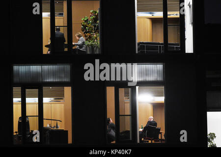 German Chancellor Angela Merkel (CDU), the chairman of the Christian Social Union in Bavaria (CSU) and Bavaria's Premier, Horst Seehofer (hidden) as well as state party group leader of the CSU, Alexander Dobrindt (upper floor), and the chairman of the Social Democratic Party of Germany (SPD), Martin Schulz and the SPD faction leader Andrea Nahles prepare for the high-level meeting in the Jakob-Kaiser-Haus in the German Bundestag in Berlin, Germany, 13 December 2017. The party and faction leaders of the Christian Democratic Union of Germany (CDU), the Christian Social Union in Bavaria (CSU) and Stock Photo