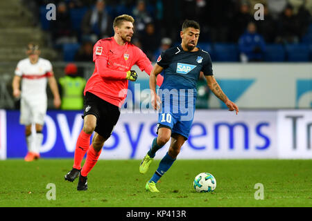 Sinsheim, Germany. 13th Dec, 2017. Stuttgart's goalkeeper Ron-Robert Zieler loses a battle with Hoffenheim's Kerem Demirbay during the German Bundesliga soccer match between 1899 Hoffenheim and VfB Stuttgart in the Rhein-Neckar-Arena in Sinsheim, Germany, 13 December 2017. Hoffenheim won 1-0. Credit: Uwe Anspach/dpa/Alamy Live News Stock Photo