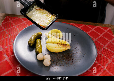 raclette cheese on a table Stock Photo - Alamy