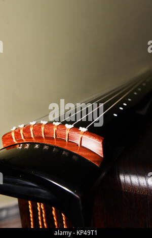 Guqin is a traditional Chinese musical string instrument. Stock Photo