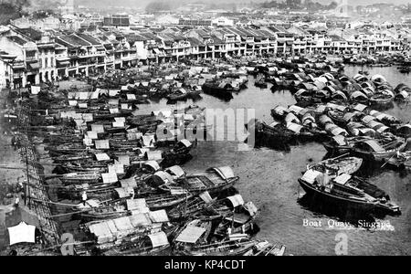 Boat Quay on the southern bank of the Singapore River, British Malaya circa 1920. The quay was completed in 1842 and was at the heart of the river trade until the 1960s. Stock Photo