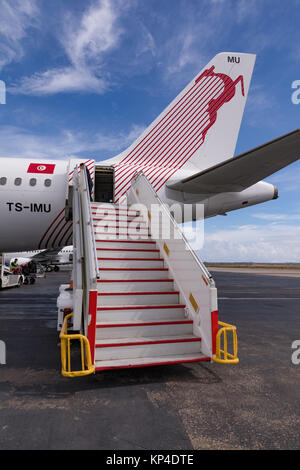 MONASTIR, TUNISIA, AFRICA - October 05, 2017. Habib Bourguiba International airport in Monastir. Stairs from the aircraft of the Tunisair. View from r Stock Photo