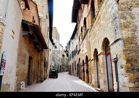 Stone and brick walls in the hill town of San Gimignano, Tuscany, Italy Stock Photo