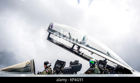 170804-N-SJ730-403 ATLANTIC OCEAN (Aug. 4, 2017) U.K. Carrier Strike Group Commander Cdre. Andrew Betton, right, and Lt. Cmdr. Sean Stuart prepare to exit an F/A-18F Super Hornet, attached to the 'Blacklions' of Strike Fighter Squadron (VFA) 213, on the flight deck aboard the Nimitz-class aircraft carrier USS George H.W. Bush (CVN 77) during Exercise Saxon Warrior 2017, Aug. 4. Saxon Warrior is a United States and United Kingdom co-hosted carrier strike group exercise that demonstrates interoperability and capability to respond to crises and deter potential threats. (U.S. Navy Stock Photo