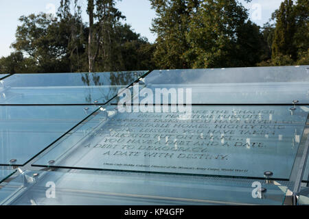 Women form the Oklahoma Air and Army National Guard read quotes, by and for military women, that are atched into glass panels on the upper terrace of the Women in Military Service for America Memorial, the ceremonial entrance to Arlington National Cemetery in Washinton D.C., Oct. 20, 2017. Stock Photo