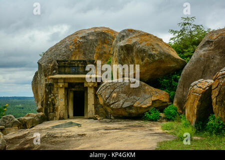 Bhadrabahu cave temple with stone pillars in between the rocks on Chandragiri hill temple complex at Shravanabelagola Stock Photo