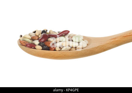 Mix of dried beans in a wooden spoon isolated against white Stock Photo