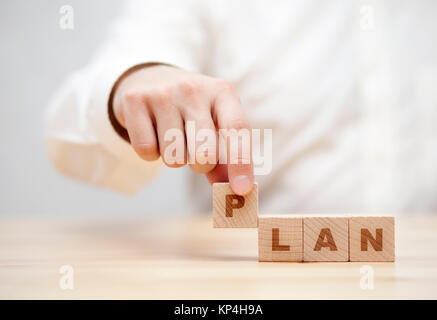Hand and word Plan made with wooden building blocks Stock Photo