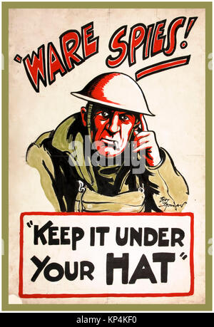 1940's WW2 UK British propaganda poster featuring a British Tommy soldier for anti-rumour and careless talk `Ware spies! Keep it under your hat Artist Bert Thomas Stock Photo