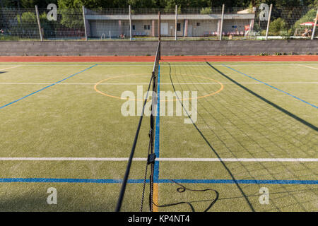 Outdoor playground for tennis, volleyball and football. Net on the playground Stock Photo