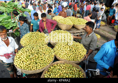 NARSINGDI, BANGLADESH - JUNE 10, 2016: Bangladeshi farmers sell Burmese grape at a market in Narsingdi, near Dhaka. Burmese grape or Lotkon in Bangla  Stock Photo