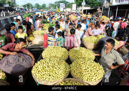 NARSINGDI, BANGLADESH - JUNE 10, 2016: Bangladeshi farmers sell Burmese grape at a market in Narsingdi, near Dhaka. Burmese grape or Lotkon in Bangla  Stock Photo