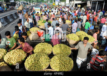 NARSINGDI, BANGLADESH - JUNE 10, 2016: Bangladeshi farmers sell Burmese grape at a market in Narsingdi, near Dhaka. Burmese grape or Lotkon in Bangla  Stock Photo