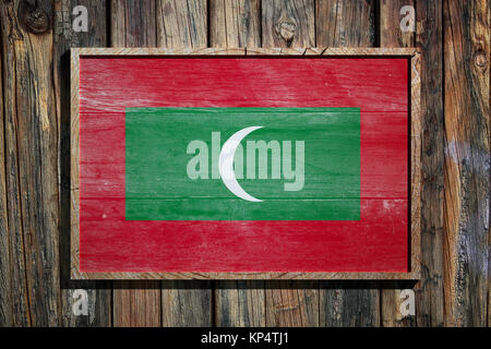 3d rendering of Maldives flag on a wooden frame over a planks wall Stock Photo