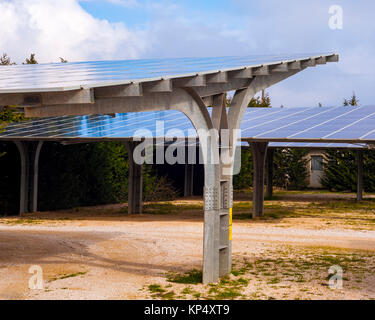 Steel shed with solar panels installed in the country Stock Photo