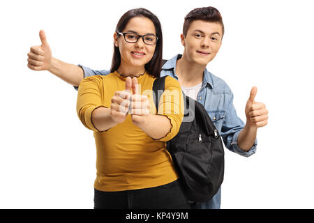 Teenage students making thumb up gestures isolated on white background Stock Photo