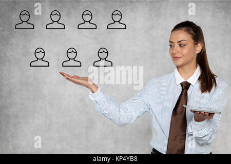 businesswoman shows how to easily manage people Stock Photo