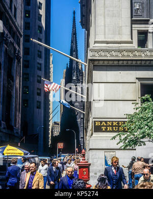 May 1982,New York,Wall street,people,Trinity church,financial district,lower Manhattan,New york City,NY,NYC,USA, Stock Photo
