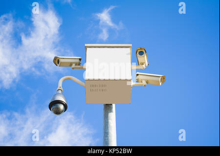 four outside security cameras cover multiple angles on blue sky Stock Photo