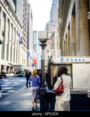 May 1982,New York,public pay phone booth,executive woman,Wall street,financial district,lower Manhattan,New york City,NY,NYC,USA, Stock Photo