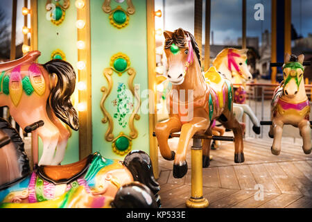 merry go round horse carousel ride at amusement park Stock Photo